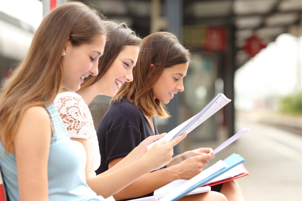 Profile,Of,Three,Students,Studying,And,Learning,Reading,Notes,In