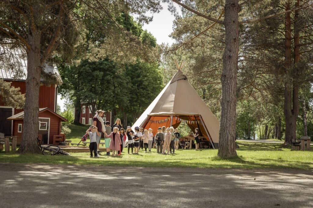 children-group-outside-tipi